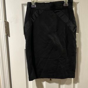 Bebe black mini skirt with back zipper; size 2